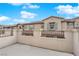 Exterior view of the home featuring stucco walls and tile roofing at 56 Lomita Heights Dr, Las Vegas, NV 89138