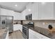 Well-equipped kitchen showcases stainless steel appliances and ample white cabinetry for storage at 56 Lomita Heights Dr, Las Vegas, NV 89138