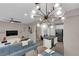 Open floor plan showcasing living room and kitchen with an island and stainless steel appliances at 56 Lomita Heights Dr, Las Vegas, NV 89138