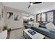 Open-concept living and dining area featuring stylish decor and modern lighting at 56 Lomita Heights Dr, Las Vegas, NV 89138