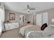 Comfortable main bedroom featuring a ceiling fan, ensuite, and a stylish accent wall decoration at 56 Lomita Heights Dr, Las Vegas, NV 89138