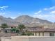 Scenic community rooftop view of mountains with mature trees and desert landscape at 56 Lomita Heights Dr, Las Vegas, NV 89138