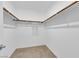 Empty walk-in closet with carpeted floor and white walls, ready for customization at 56 Lomita Heights Dr, Las Vegas, NV 89138