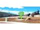 Vacant lot with public art installation of a tree with an attached bench at 5617 Tanya Ave, Las Vegas, NV 89107
