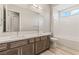 Bright bathroom with double vanity, shower and separate tub at 6312 Zephyr Peak Ct, Las Vegas, NV 89149