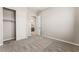 Carpeted bedroom features a closet and bathroom entry at 6312 Zephyr Peak Ct, Las Vegas, NV 89149