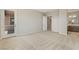 Spacious carpeted bedroom with ensuite bathroom and exterior door at 6312 Zephyr Peak Ct, Las Vegas, NV 89149