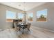 Dining room with chandelier and many windows providing ample natural light at 6312 Zephyr Peak Ct, Las Vegas, NV 89149