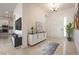 Welcoming entryway featuring stylish console table, modern lighting, and tile flooring at 6312 Zephyr Peak Ct, Las Vegas, NV 89149