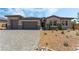 Charming single-story home featuring a three-car garage and desert landscaping at 6312 Zephyr Peak Ct, Las Vegas, NV 89149