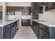 Spacious kitchen featuring dark cabinetry, stainless steel appliances, and modern countertops at 6312 Zephyr Peak Ct, Las Vegas, NV 89149