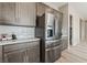 Kitchen featuring stainless steel refrigerator and stainless hardware on wood cabinetry at 6312 Zephyr Peak Ct, Las Vegas, NV 89149