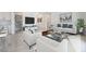 Bright and modern living room with stylish furniture, large windows, and sleek flooring at 6312 Zephyr Peak Ct, Las Vegas, NV 89149