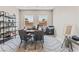 Office space with dark desk, neutral walls, and patterned rug at 6312 Zephyr Peak Ct, Las Vegas, NV 89149
