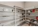 Walk-in pantry with open shelving for organized storage at 6312 Zephyr Peak Ct, Las Vegas, NV 89149