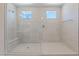 Walk-in shower with built in bench, glass door, and dual shower heads at 6312 Zephyr Peak Ct, Las Vegas, NV 89149