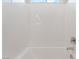 White tiled bathtub with chrome faucet and shower head at 6312 Zephyr Peak Ct, Las Vegas, NV 89149