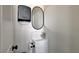 Compact half-bathroom featuring a modern vanity, mirror, and fixtures, optimizing space efficiency at 6587 Lucky Boy Dr, Las Vegas, NV 89110