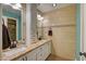 Updated bathroom with dual sinks, granite countertops and custom tile at 6587 Lucky Boy Dr, Las Vegas, NV 89110