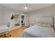 Cozy bedroom featuring a desk, a ceiling fan, and a door to a laundry room at 6587 Lucky Boy Dr, Las Vegas, NV 89110