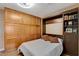 Bedroom featuring a murphy bed with extra storage cabinets, providing both sleeping and organizational space at 6587 Lucky Boy Dr, Las Vegas, NV 89110
