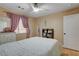 Neutral bedroom featuring a ceiling fan, a window, a full bed, and a dresser at 6587 Lucky Boy Dr, Las Vegas, NV 89110
