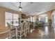 Dining room features chandelier, coordinated dining set, open floor plan, and ample natural light at 6587 Lucky Boy Dr, Las Vegas, NV 89110