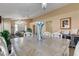 Open-concept dining room featuring stylish furnishings and a decorative vase on the wooden table at 6587 Lucky Boy Dr, Las Vegas, NV 89110