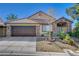 Charming single-story home featuring desert landscaping, a brick facade and a two-car garage at 6587 Lucky Boy Dr, Las Vegas, NV 89110