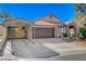 Charming single-story home showcasing a well-maintained front yard with a covered parking structure and a two-car garage at 6587 Lucky Boy Dr, Las Vegas, NV 89110