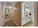 Hallway bathroom with neutral tones, decorative mirror and vanity at 6587 Lucky Boy Dr, Las Vegas, NV 89110