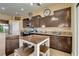 Eat-in kitchen features granite countertops, stainless appliances, and breakfast nook at 6587 Lucky Boy Dr, Las Vegas, NV 89110