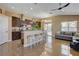Bright kitchen featuring dark wood cabinets, breakfast bar, and ample counter space, with an open layout at 6587 Lucky Boy Dr, Las Vegas, NV 89110