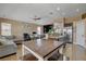 Open floor plan featuring a large eat in kitchen and living area with vaulted ceilings at 6587 Lucky Boy Dr, Las Vegas, NV 89110