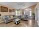 Elegant living room showcasing modern decor, recessed lighting, and a comfortable seating arrangement for relaxation and entertaining at 6587 Lucky Boy Dr, Las Vegas, NV 89110