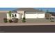 Beautiful single-story home with a three car garage, neutral colored stucco, and a tile roof at 6925 Unicorn St, Las Vegas, NV 89131