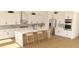 Bright kitchen featuring stainless steel appliances, a large marble island with seating, and white cabinets at 6925 Unicorn St, Las Vegas, NV 89131
