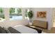 Bright main bedroom with large windows, tree views, and a neutral color palette at 6925 Unicorn St, Las Vegas, NV 89131