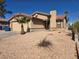Single story home with desert landscaping, garage, and red tile roof at 7324 Saybrook Point Dr, Las Vegas, NV 89128