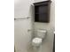 Compact bathroom with a toilet and a storage cabinet, providing essential amenities and practical storage solutions at 75 N Valle Verde Dr # 621, Henderson, NV 89074
