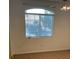 Sunlit bedroom featuring a large arched window, offering abundant natural light and a pleasant view at 75 N Valle Verde Dr # 621, Henderson, NV 89074