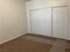 A cozy bedroom featuring a spacious closet with white sliding doors, offering ample storage space at 75 N Valle Verde Dr # 621, Henderson, NV 89074