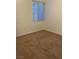 Bedroom with neutral carpet and blind-covered window, ready for personalization at 75 N Valle Verde Dr # 621, Henderson, NV 89074