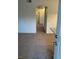 Hallway features neutral walls and plush carpeting throughout, with an arched entrance to the kitchen at 75 N Valle Verde Dr # 621, Henderson, NV 89074