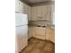 Functional kitchen with white cabinets and appliances, providing a clean and efficient cooking space at 75 N Valle Verde Dr # 621, Henderson, NV 89074