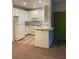 Bright kitchen features white cabinetry, tile floors and a breakfast bar for casual dining at 75 N Valle Verde Dr # 621, Henderson, NV 89074