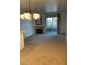 Cozy living room features a fireplace, chandelier and a sliding door to the outdoor patio at 75 N Valle Verde Dr # 621, Henderson, NV 89074