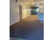 Spacious living room with plush carpeting, chandelier, and a mirrored wall for a more open feel at 75 N Valle Verde Dr # 621, Henderson, NV 89074