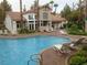Community pool surrounded by lounge chairs and well-maintained landscaping, ideal for relaxation at 75 N Valle Verde Dr # 621, Henderson, NV 89074