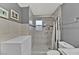 Bathroom showcasing tiled walk-in shower with a glass door and modern fixtures at 7713 Shore Haven Dr, Las Vegas, NV 89128